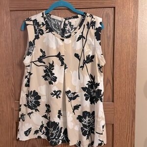 J. Crew 100% Polyester, needs a slight alteration. Bottom hem is loose.